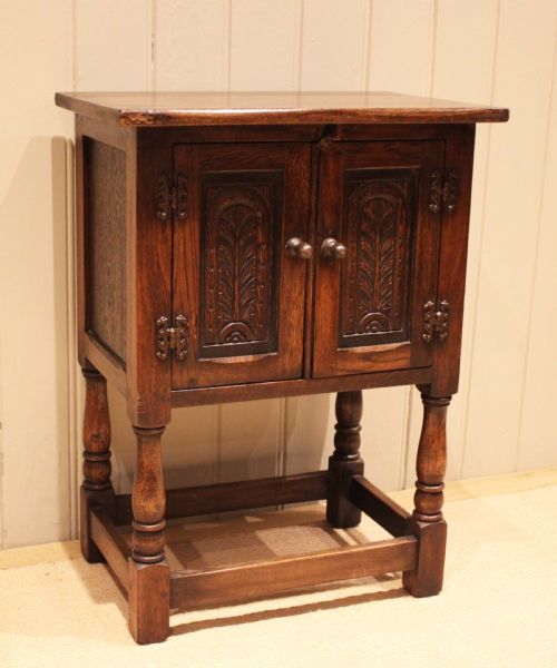 SMALL CARVED OAK SIDE CABINET