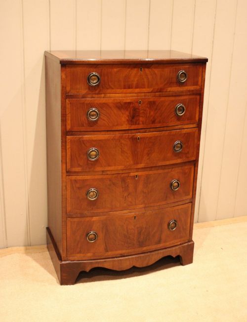 WALNUT BOW FRONT CHEST OF DRAWERS - ADDITIONAL PHOTO 1