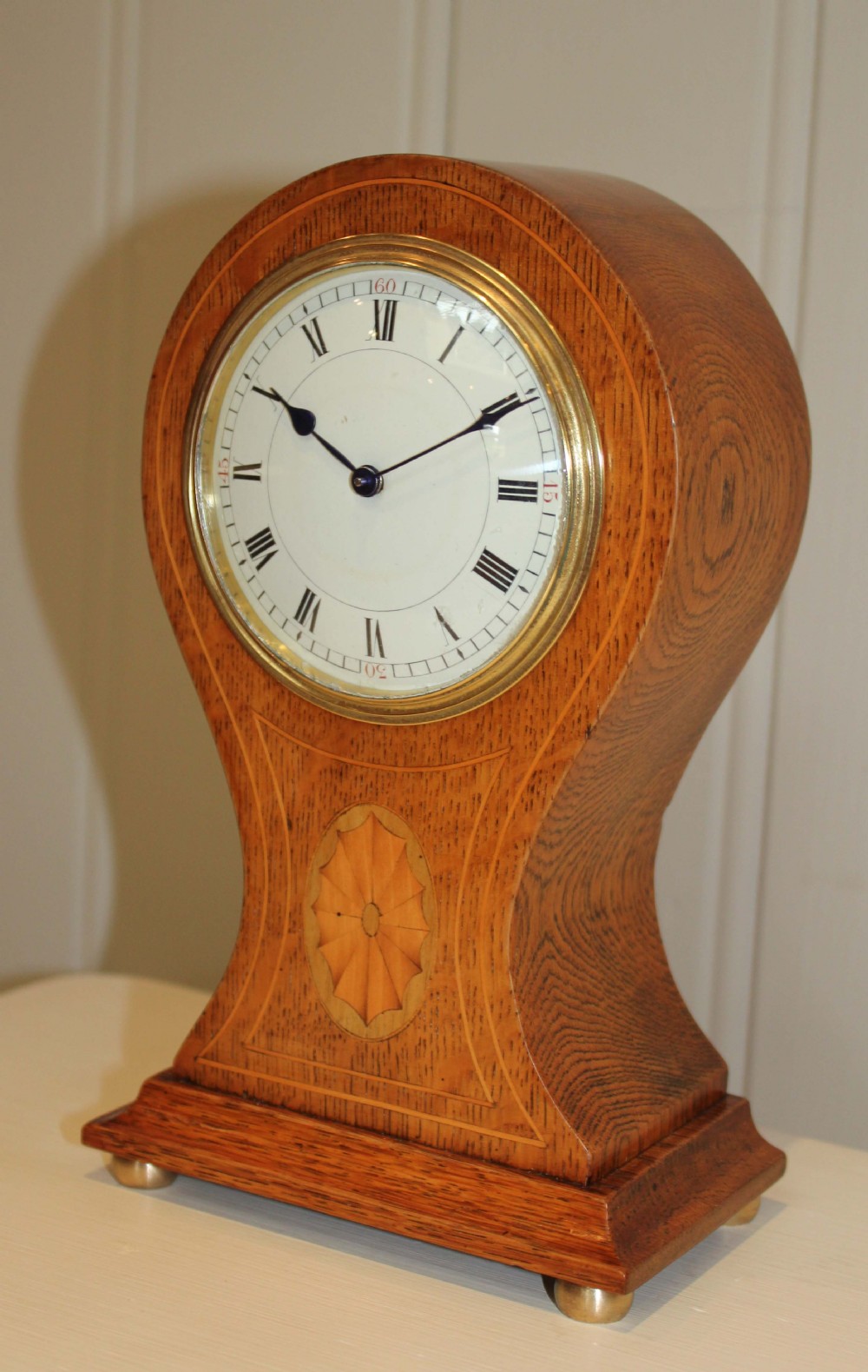 Edwardian Oak balloon clock 