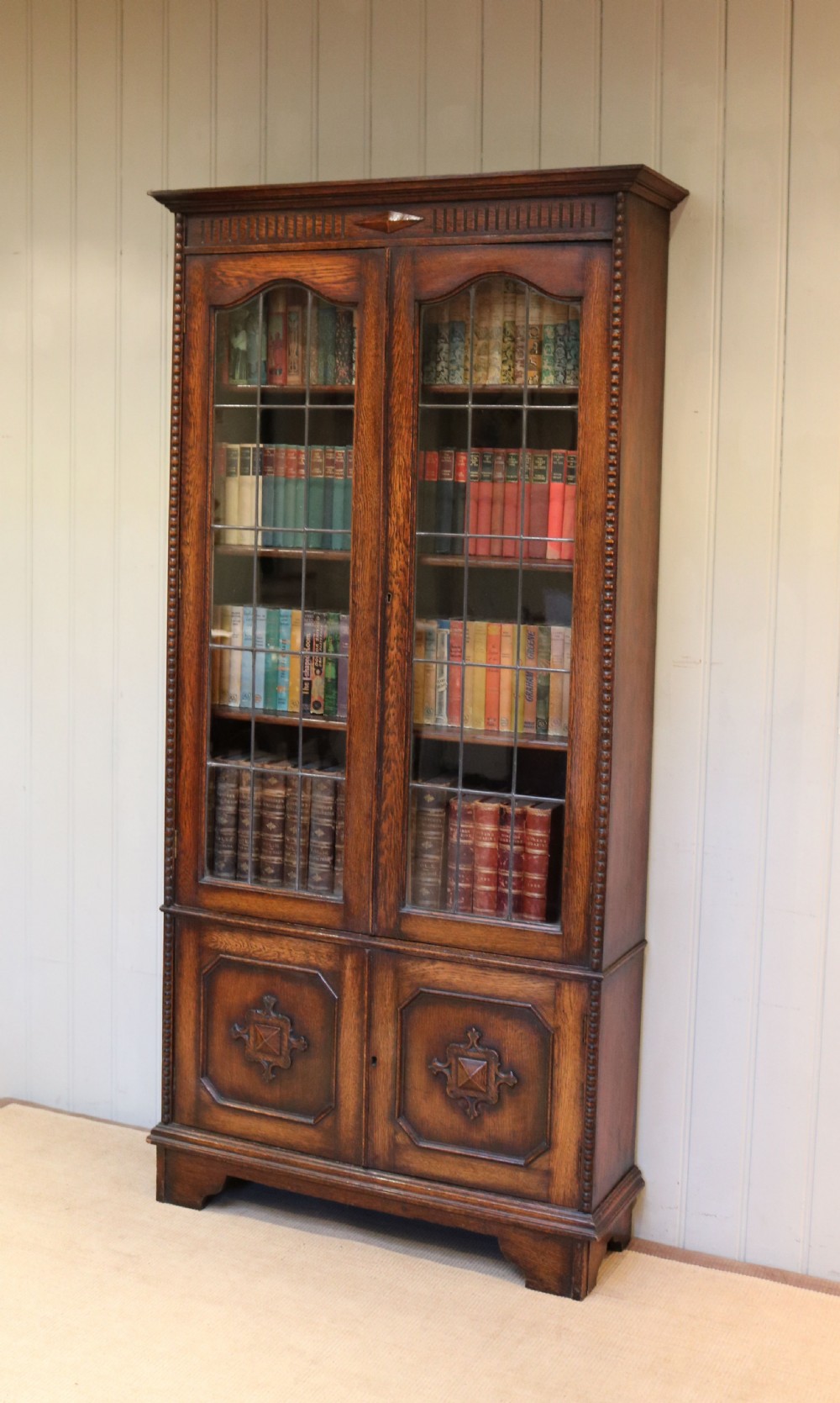 Tall Glazed Oak Bookcase