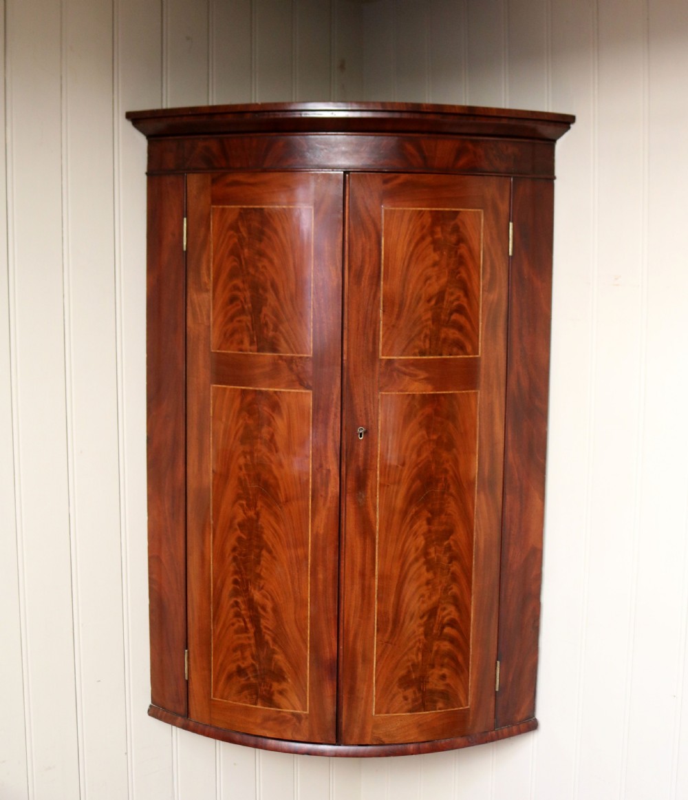 Early 19th Century Mahogany Bow Front Corner Wall Cabinet View II