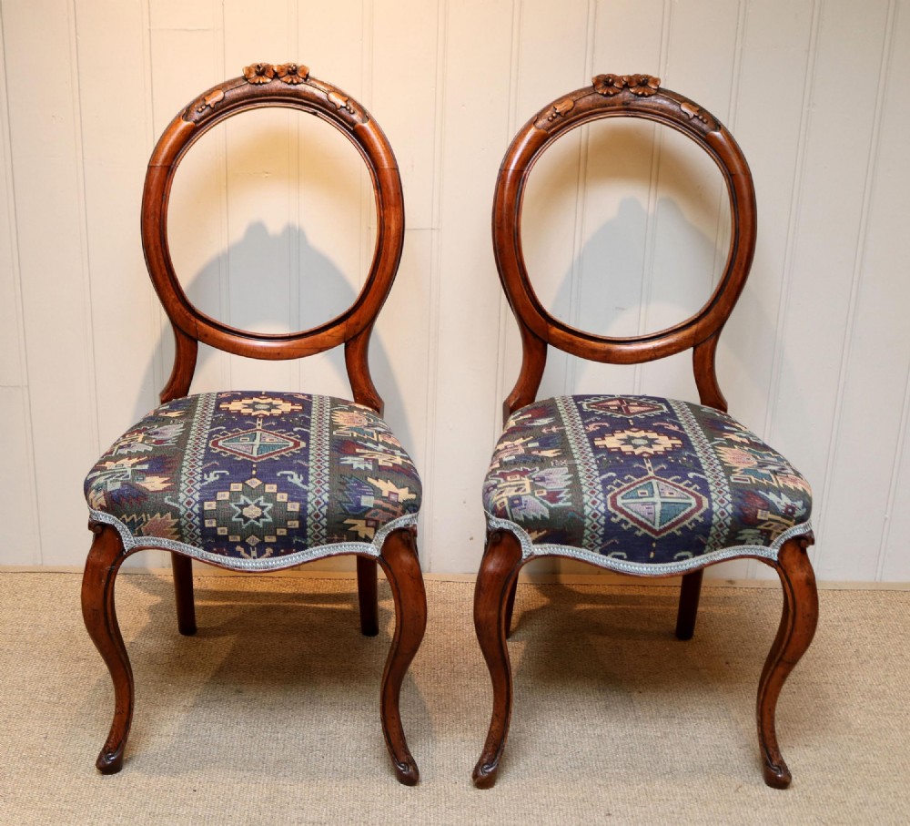 Pair Of Walnut Balloon Back Chairs