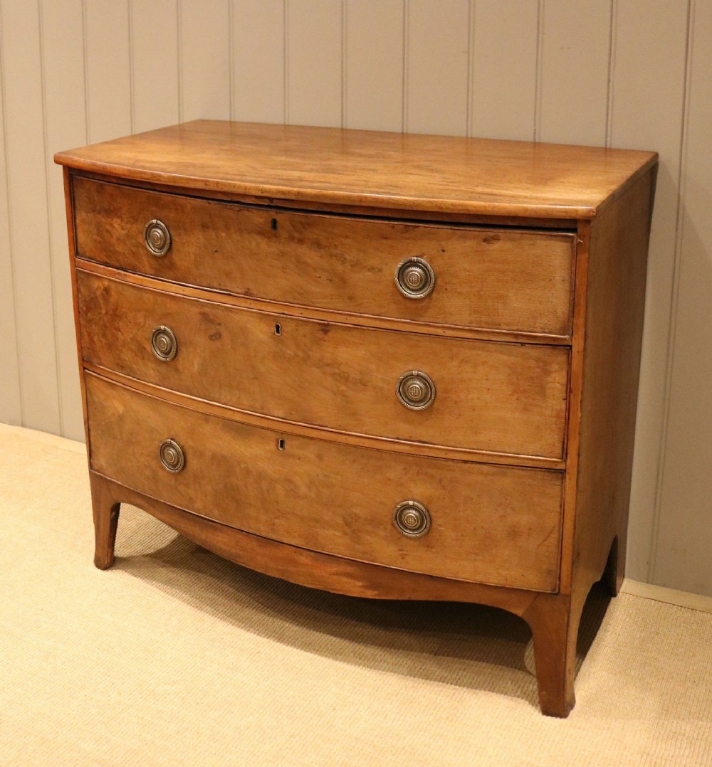 Early 19th Century Rustic Mahogany Bow Front Chest Of Drawers
