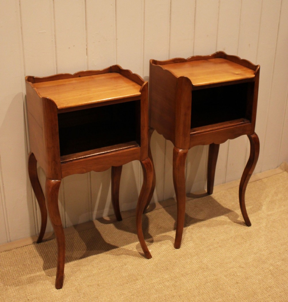 A pair of warm brown cherry wood bedside cabinets featuring open shelf compartments, scalloped top galleries, and slender cabriole legs. View III