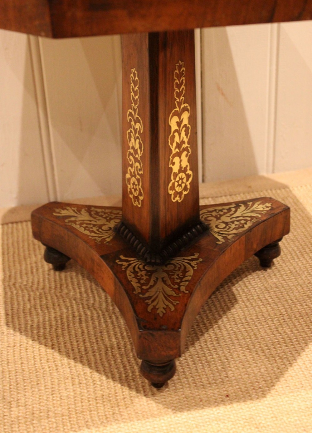 An octagonal Regency rosewood occasional table featuring an inlaid specimen marble chess board top supported by a central column and triform base. View XII
