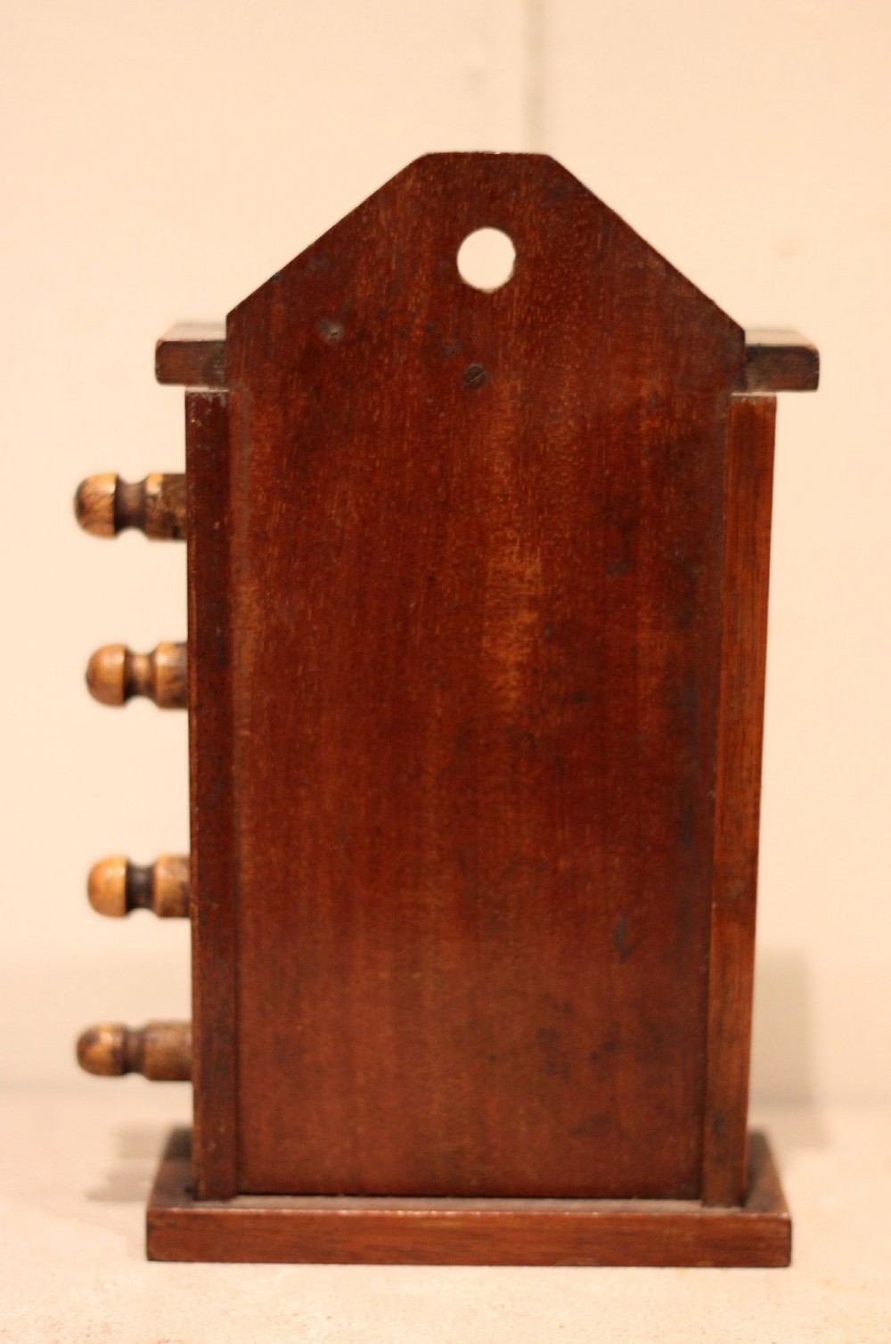 A late nineteenth-century mahogany perpetual desk calendar with turned wooden side knobs, displaying the date Saturday March 10. View IX