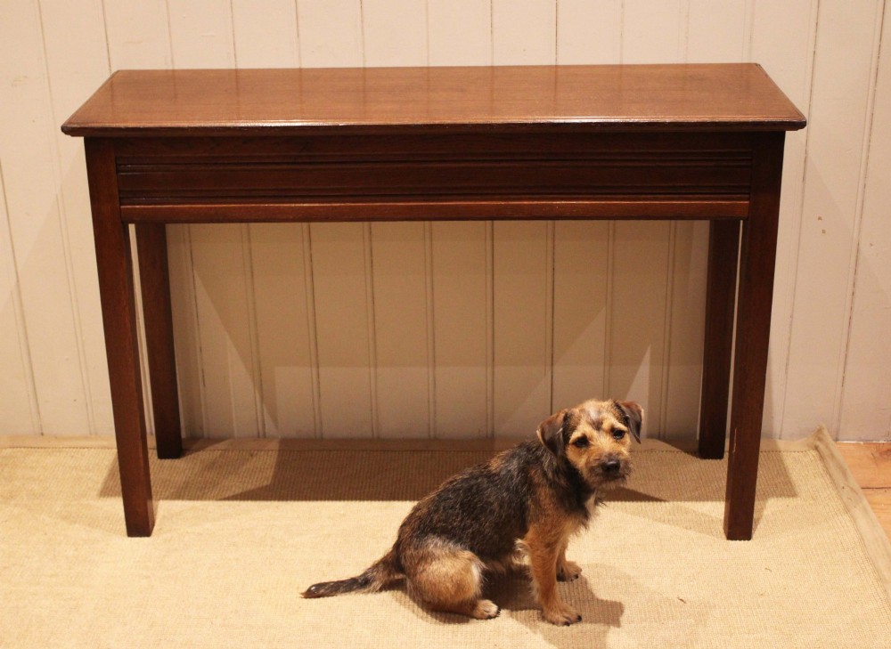 A late 19th-century oak hall table with a rectangular top, grooved apron detail, and four straight legs. View X