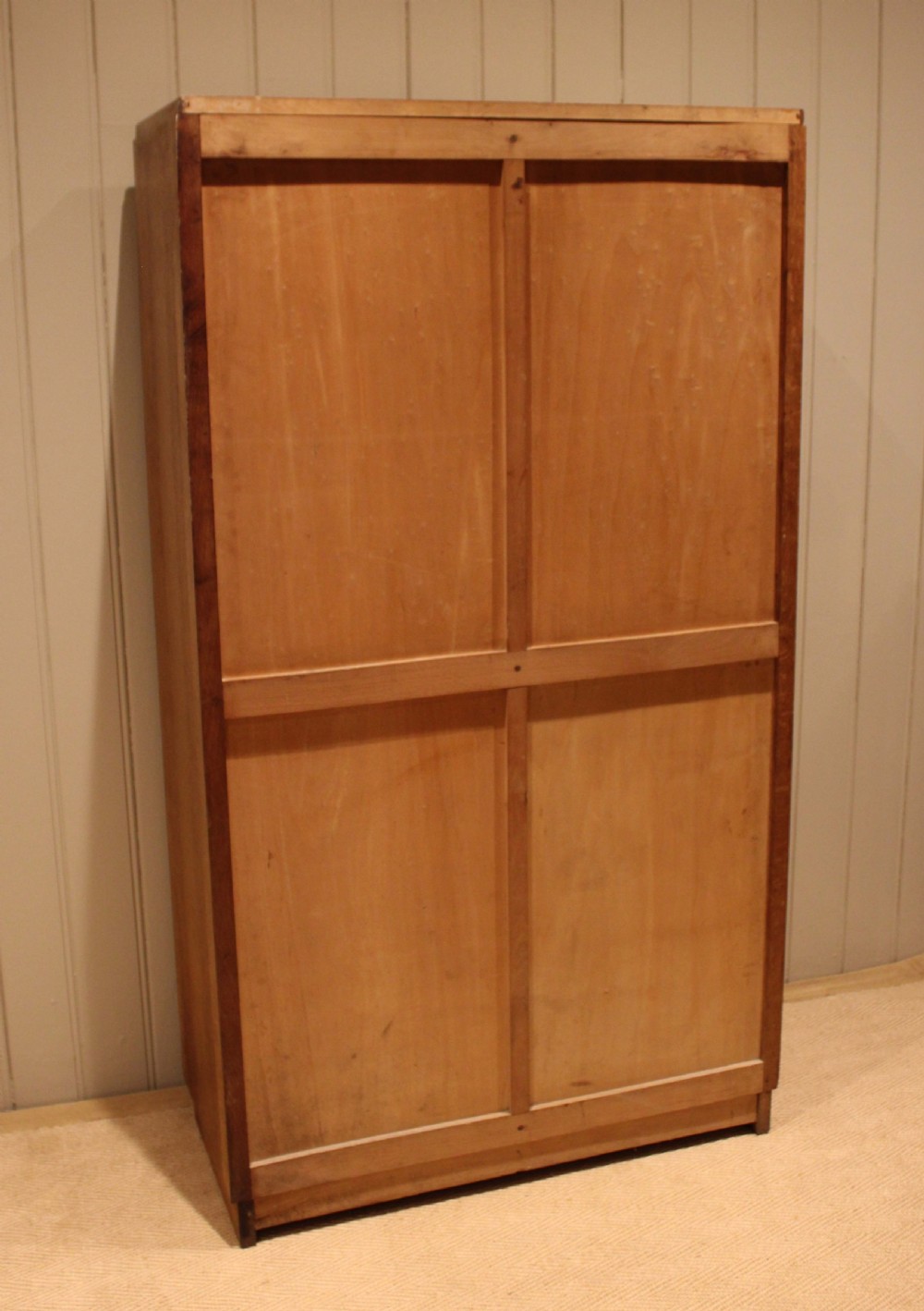 A tall French oak filing cabinet featuring twin vertical tambour slatted doors with metal handles and keyholes. View XIII
