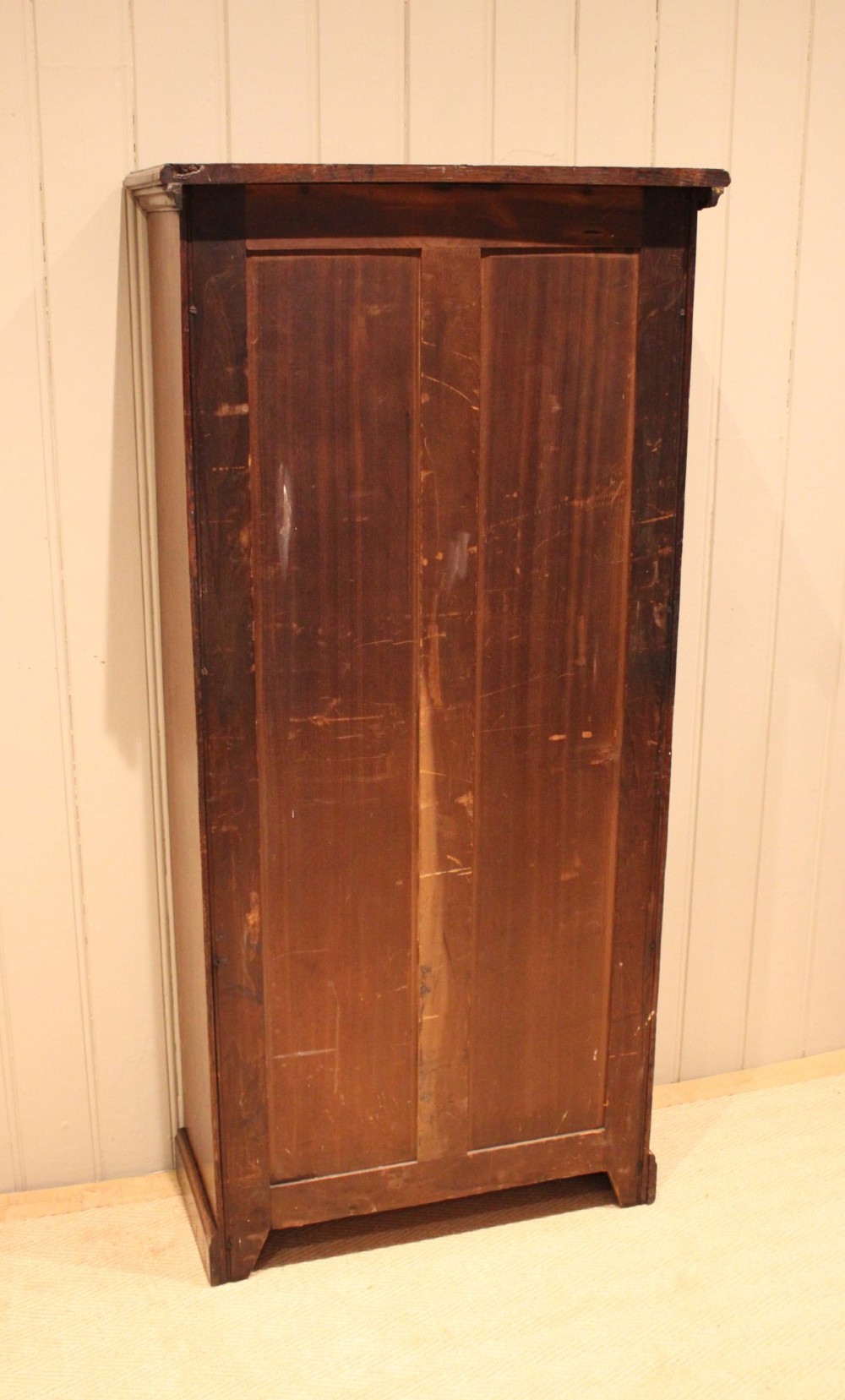 A tall late Victorian open oak bookcase featuring five adjustable shelves filled with books, a moulded top cornice, and a solid plinth base. View XIII