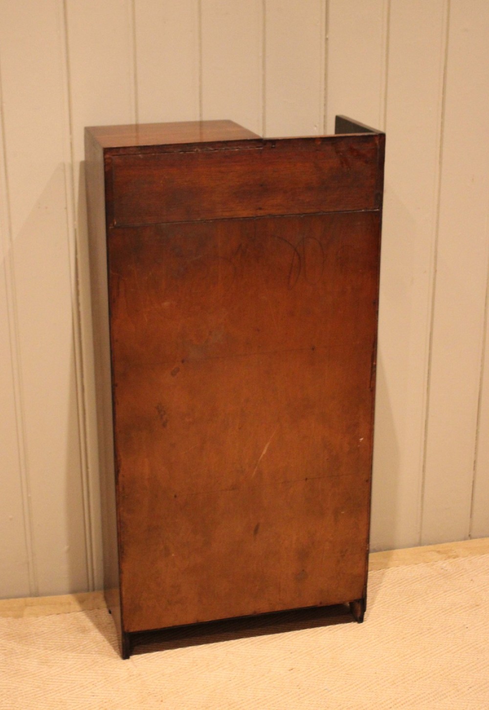 A dark oak Art Deco bookcase with open shelves on the left side, a small carved single door cabinet on the right, and two lower full-width shelves. View X