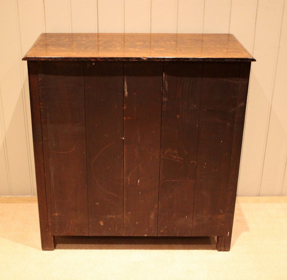 A late nineteenth-century solid oak side cabinet featuring a single top drawer above two panelled cupboard doors with turned timber handles. View IX