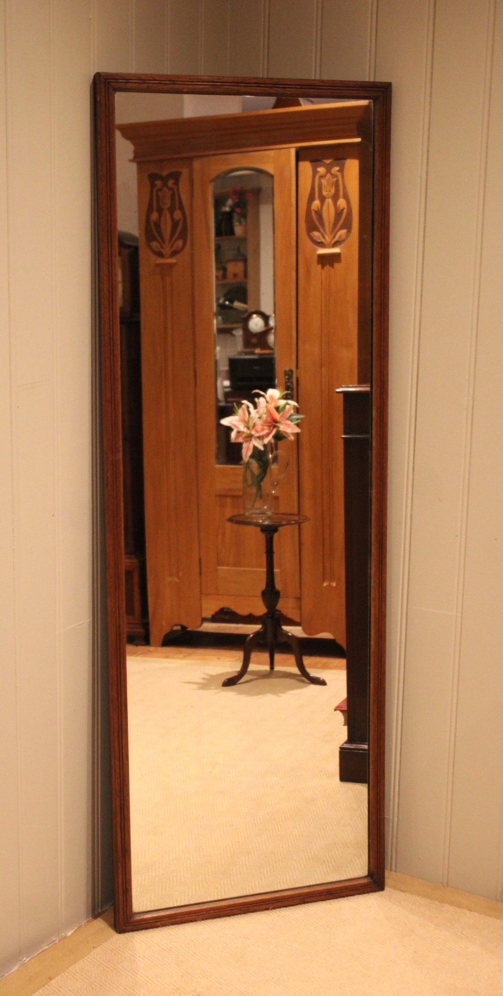 A large rectangular full-length mirror featuring a slender moulded oak frame with visible natural grain. View III
