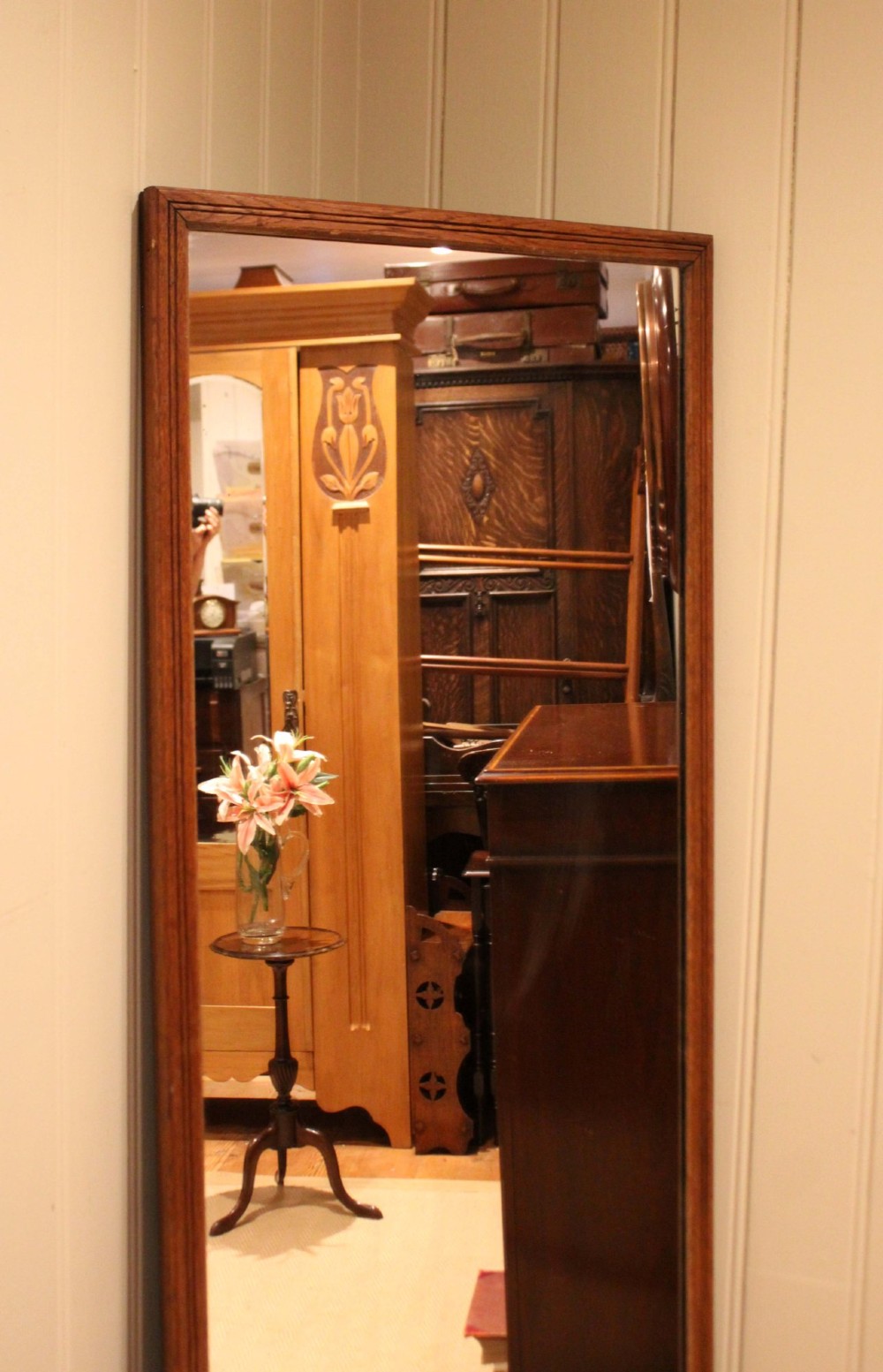 A large rectangular full-length mirror featuring a slender moulded oak frame with visible natural grain. View X