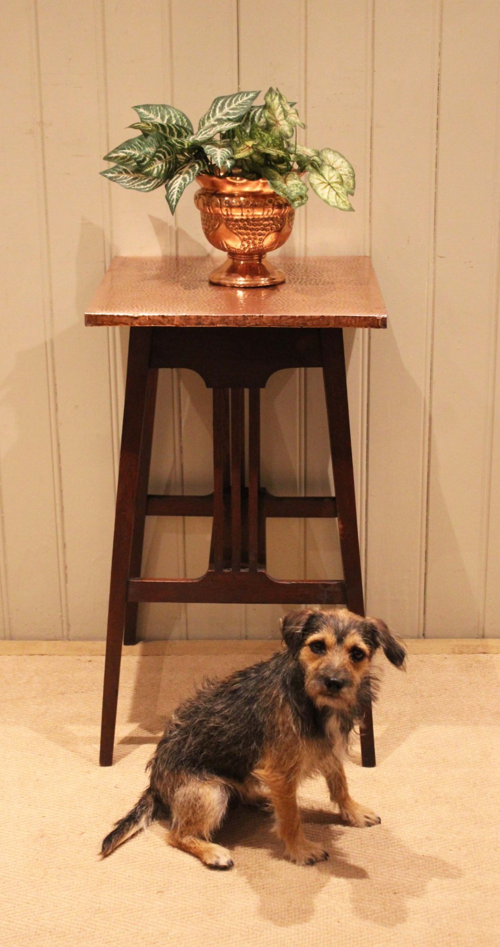 A square Arts and Crafts side table made of dark oak with a hand-hammered copper top, tapered legs, vertical slats, and cross stretchers. View IX