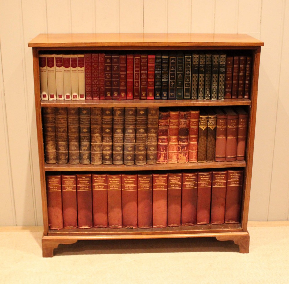 A late nineteenth-century mahogany open bookcase featuring three wide horizontal shelves and bracket feet. View III