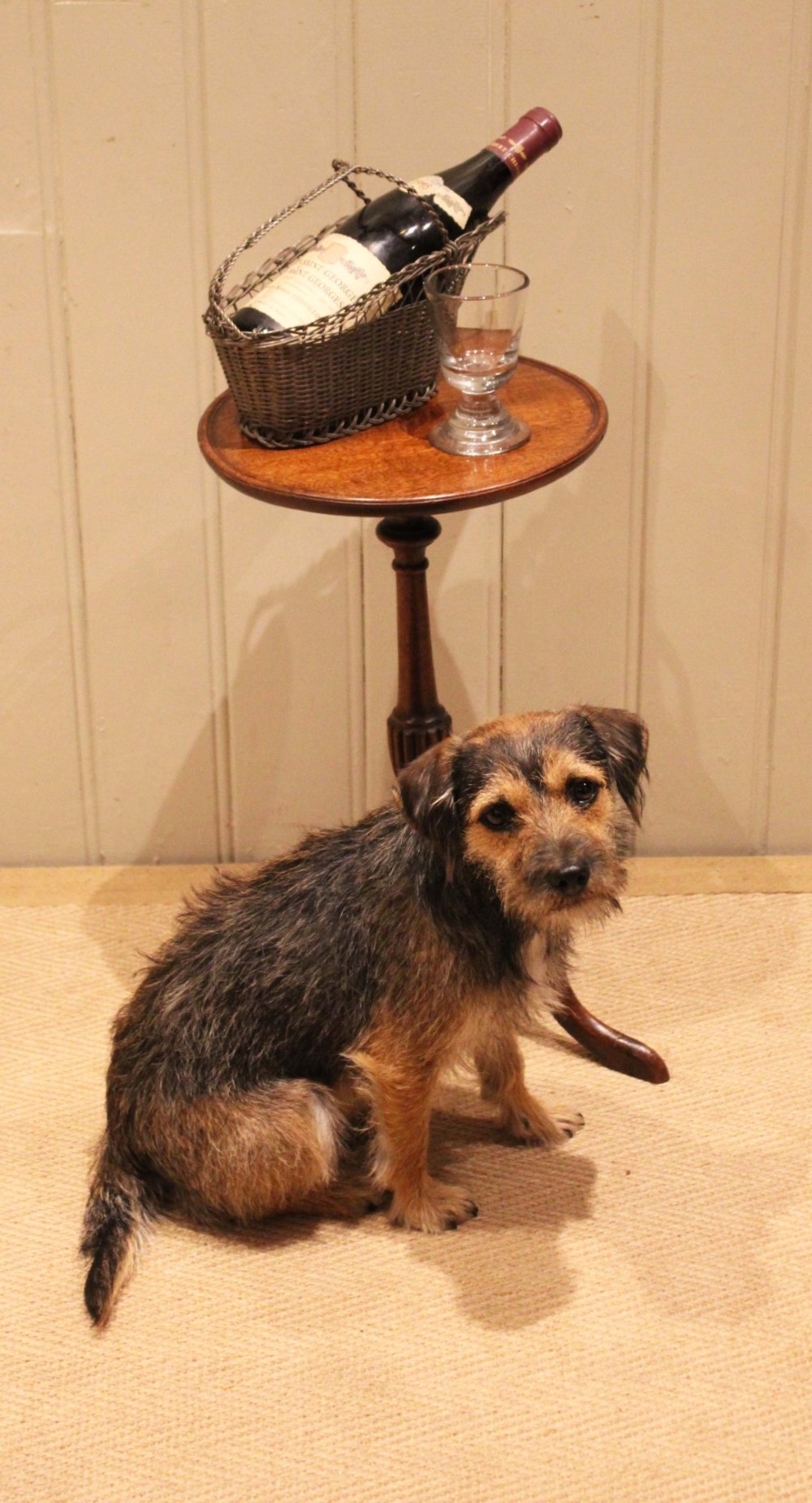 A mahogany wine table featuring a circular dished top supported by a turned reeded pedestal on three splayed cabriole legs. View IV
