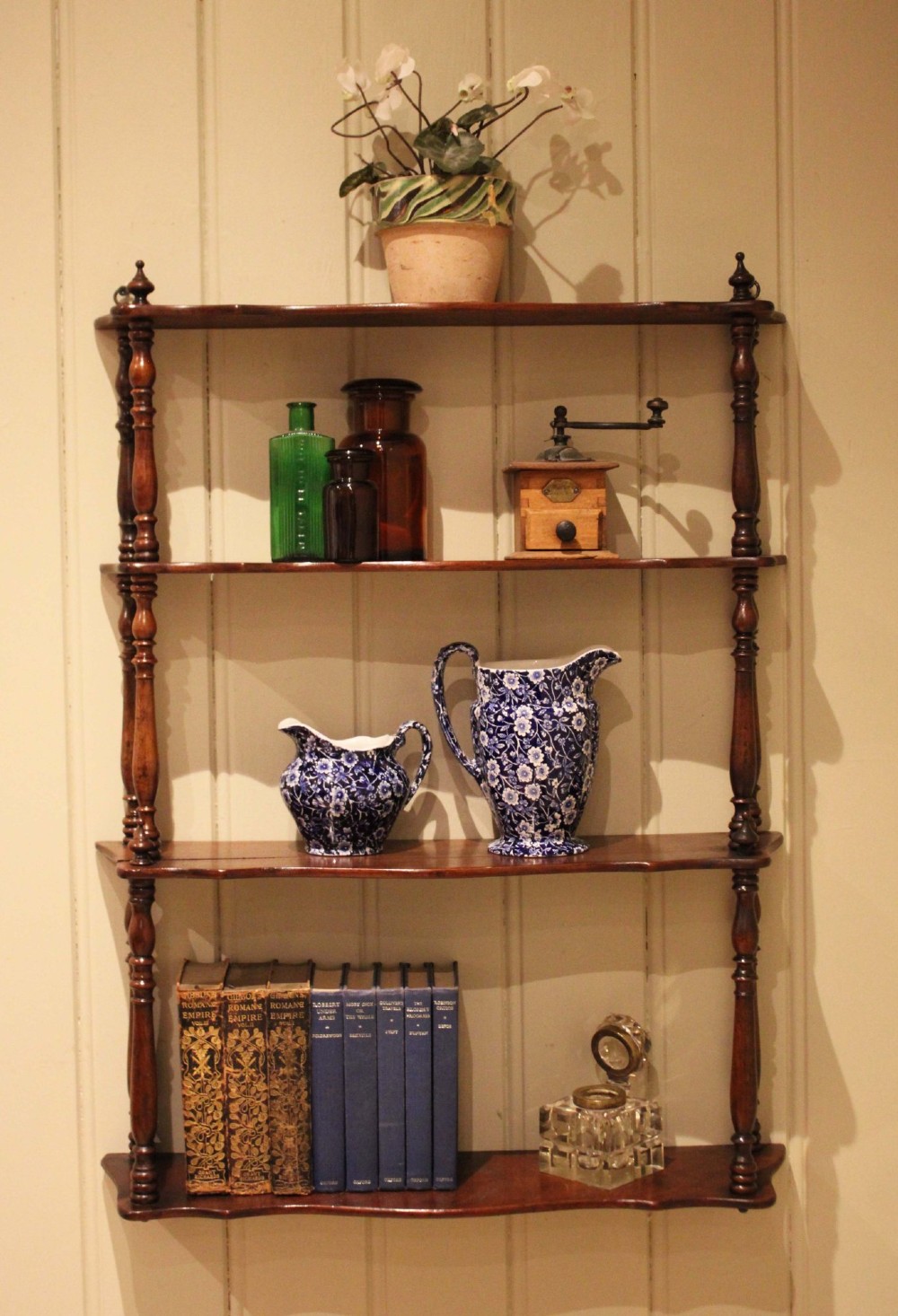 A four-tier late nineteenth-century French mahogany wall shelf unit with turned spindle supports and shaped shelf fronts. View III