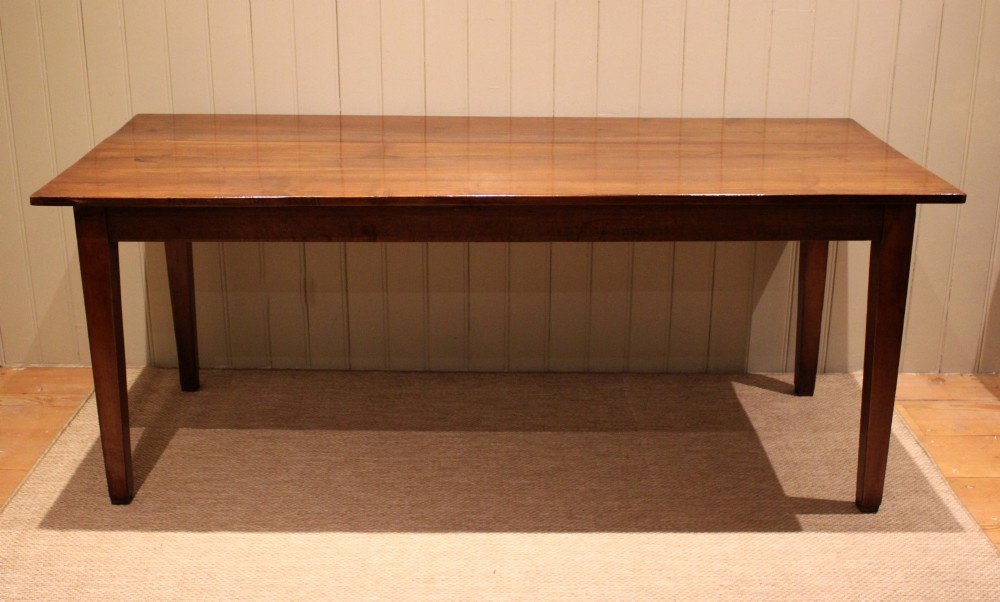 A large rectangular wooden farmhouse table made of chestnut and oak with a polished plank top and simple tapered square legs. View VIII