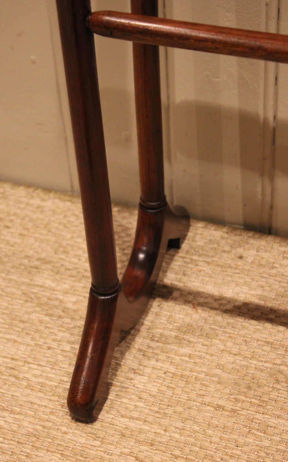 A late 19th-century mahogany freestanding towel rail featuring rounded upright arches, multiple horizontal crossbars, and curved trestle feet. View XI