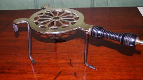 George III Period Brass and Iron Trivet with a Ring Turned Ebonised Handle