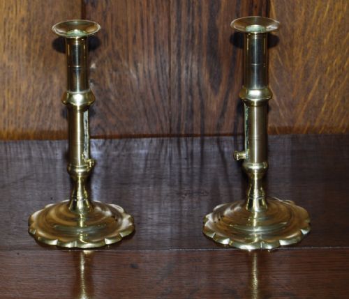 Pair of Early 18th. Century Brass Petal Based Candlesticks with Ejector Slides