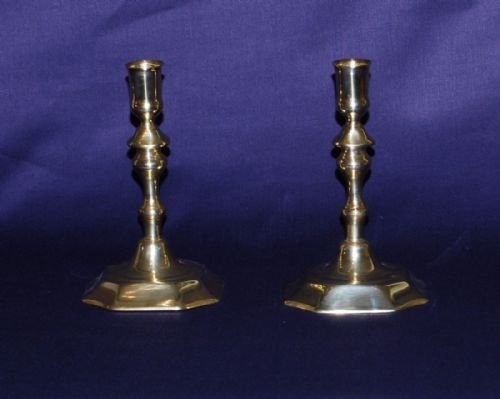 A Pair of Early 18th. Century Brass Candlesticks with an  Octagonal Foot