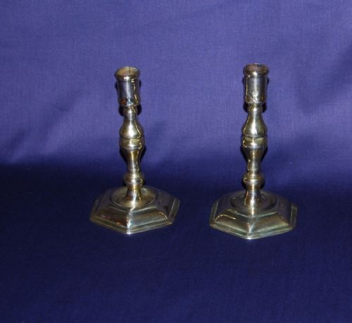 A Pair of Early 18th. Century Brass Candlesticks with a Hexagonal Foot