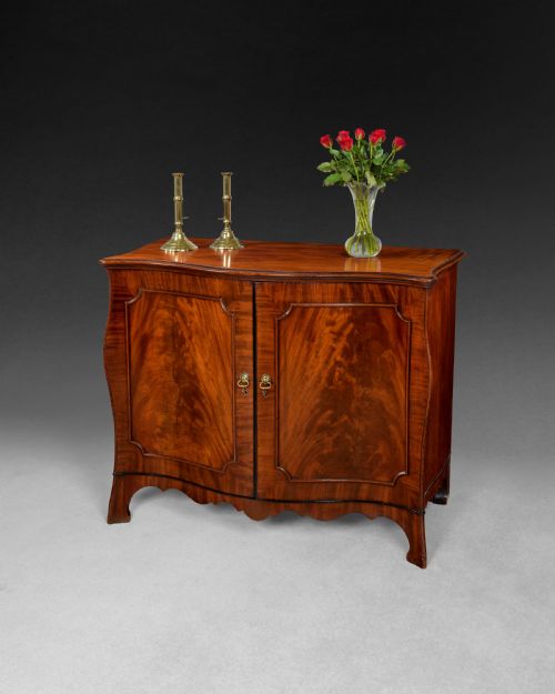 George III Flame Figured Mahogany Bombe Commode with Ebony Mouldings