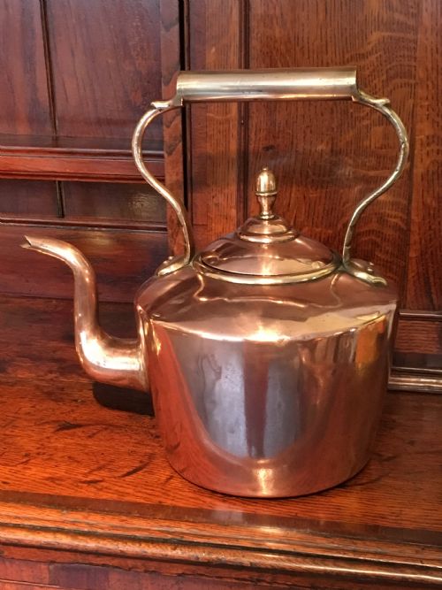 A Large Victorian Seamed Copper Kettle with a Brass Handle and Acorn Finial