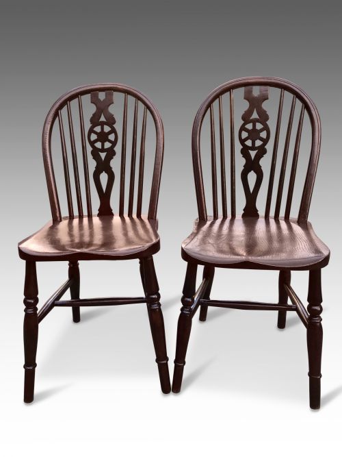 A Pair of Victorian Elm and Oak Low Wheel Back Windsor Side Chairs