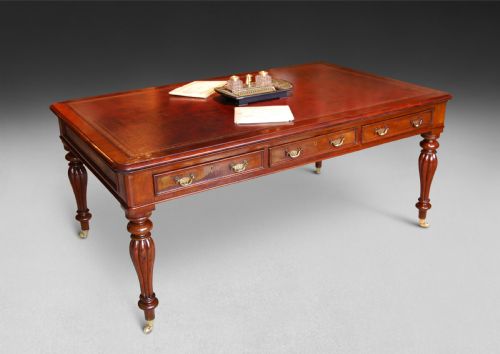 A Mid 19th. Century Mahogany Partners Writing Table