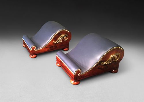 Pair of Regency Rosewood and Brass Gout Stools of Scrolling Form with Leather Upholstered Foot Rests