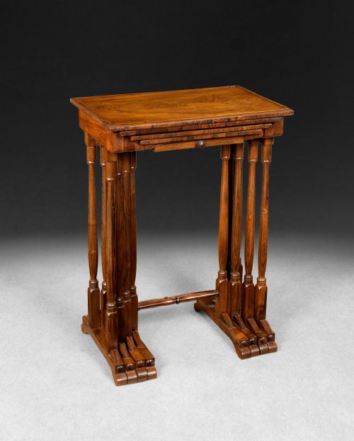 fig 1. A set of four nested Regency rosewood quartetto tables featuring turned spindle legs, twin-ring stretchers, and an inlaid chessboard on the second surface.