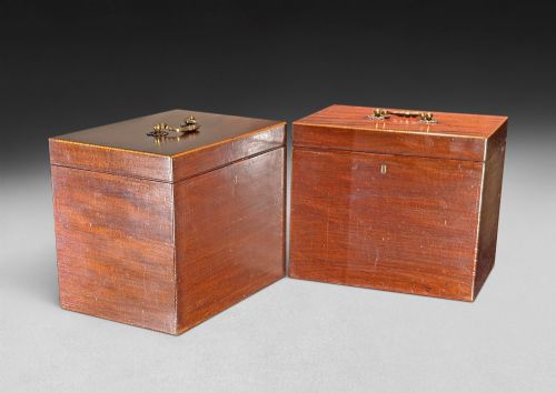 fig 3. An open George III mahogany decanter chest displaying fitted glass decanters, internal compartments, velvet lid lining, and brass hardware.