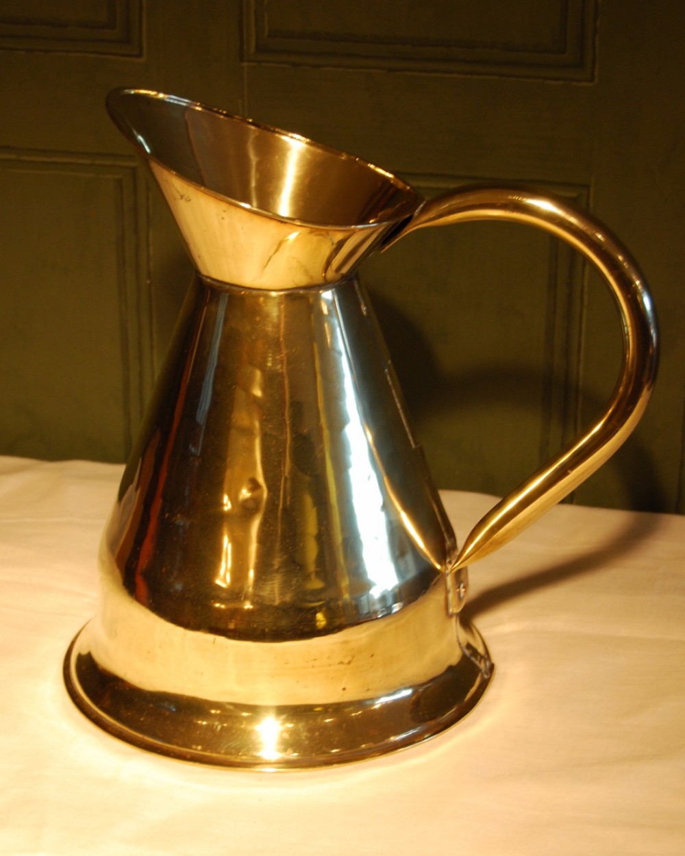 A large Brass Pitcher