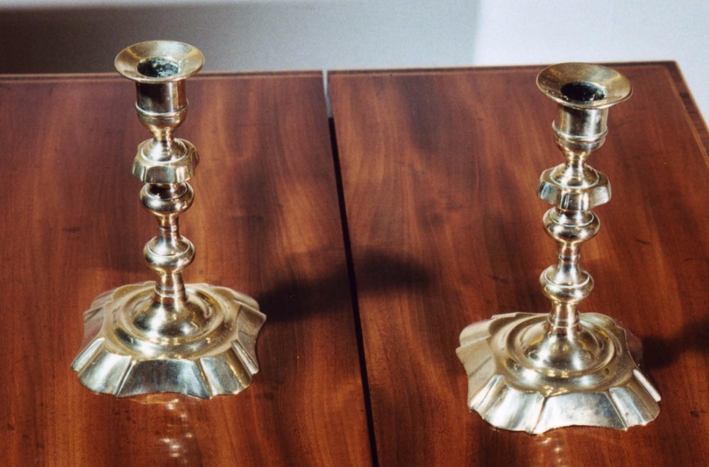 Pair of Brass Candlesticks with raised petal bases