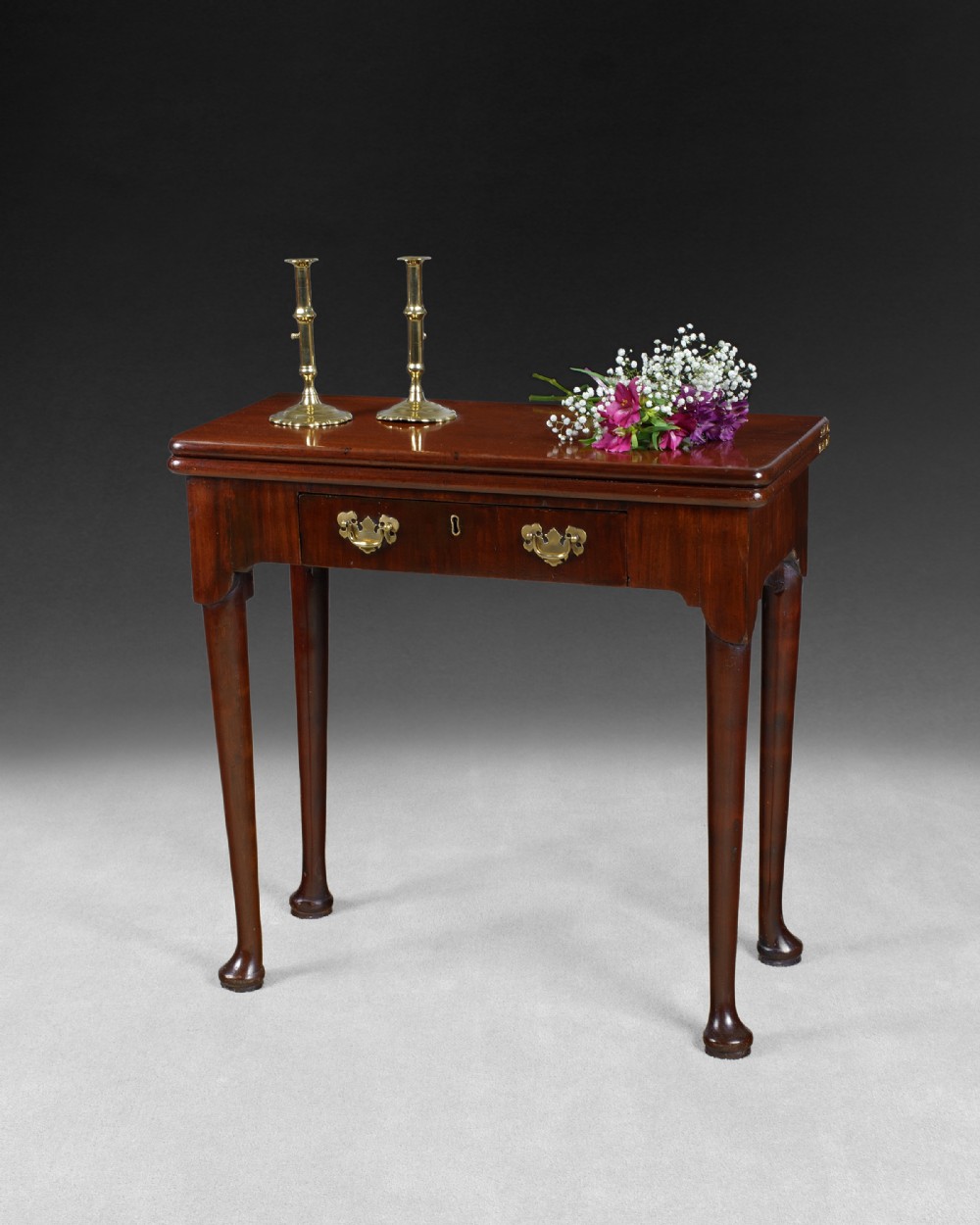George II period mahogany fold over top tea table