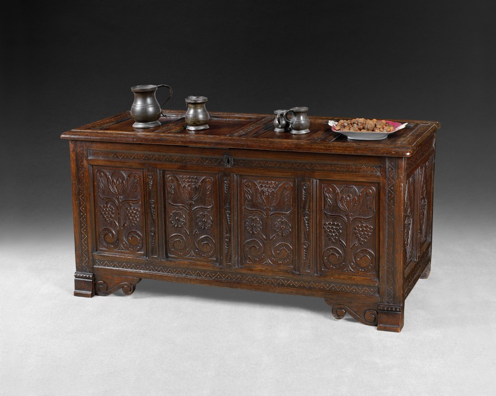 17th. century oak coffer, four panels, carved front panels, stylised flowers, ends with diamond shapes
