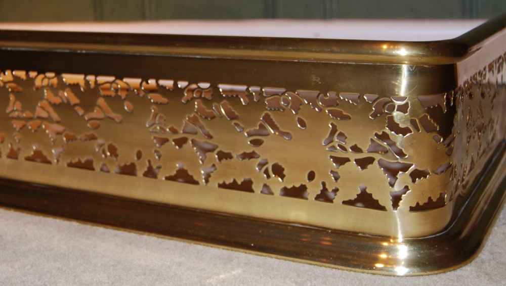 Mid 19th. century leaf pattern pierced brass fender View II