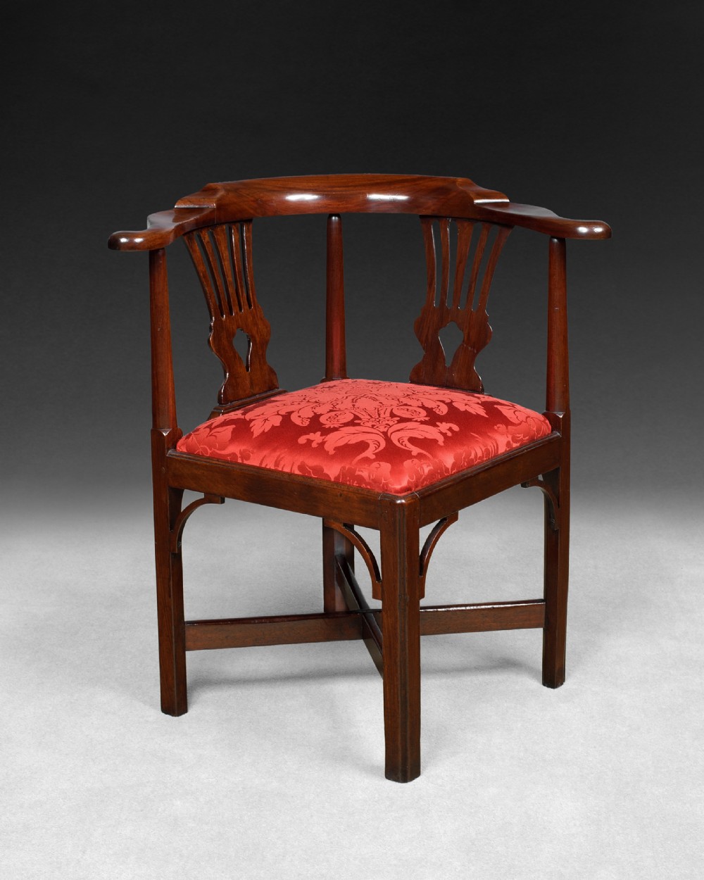 A Chippendale period mahogany corner armchair