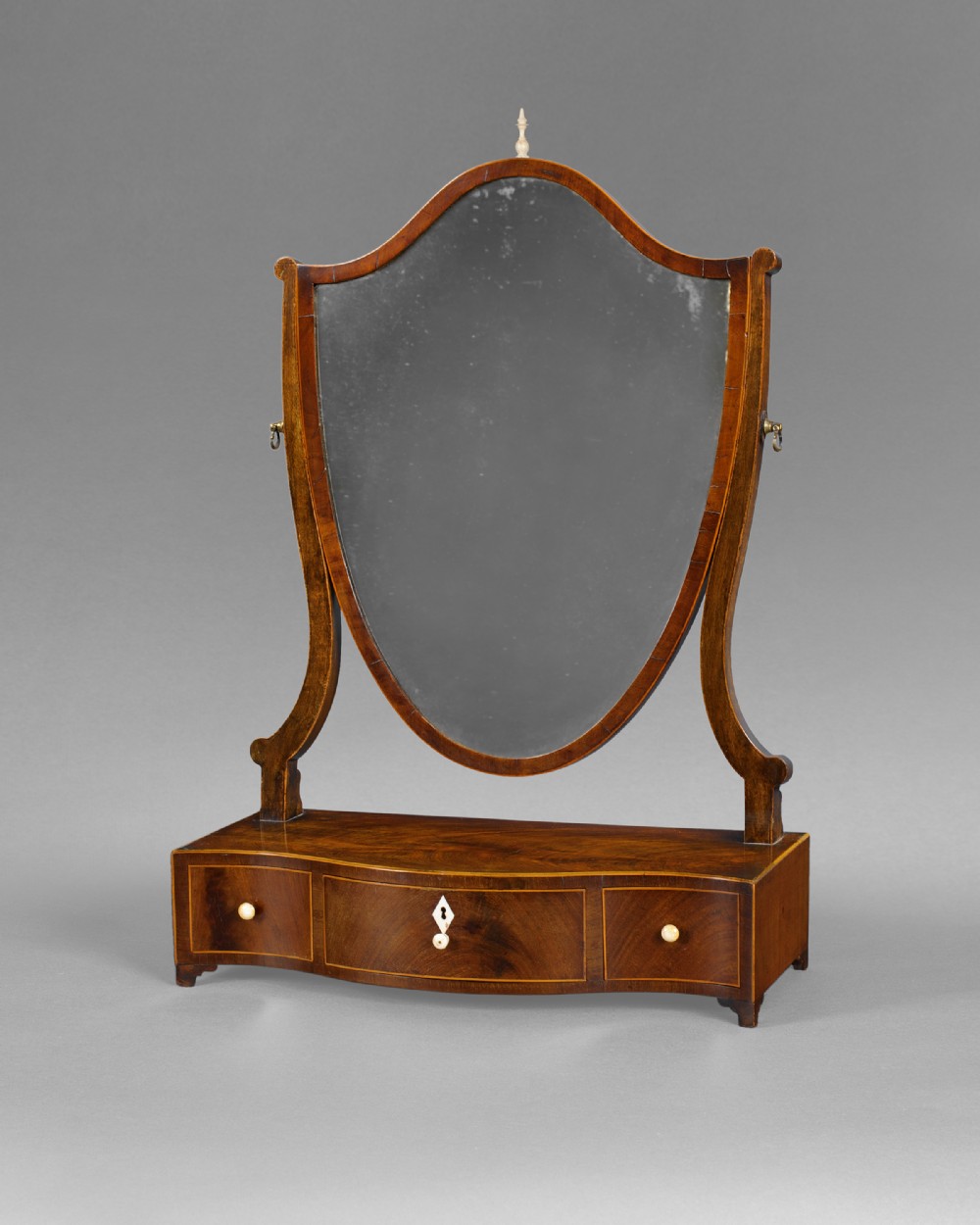 George III Mahogany and inlaid Shield shaped toilet mirror