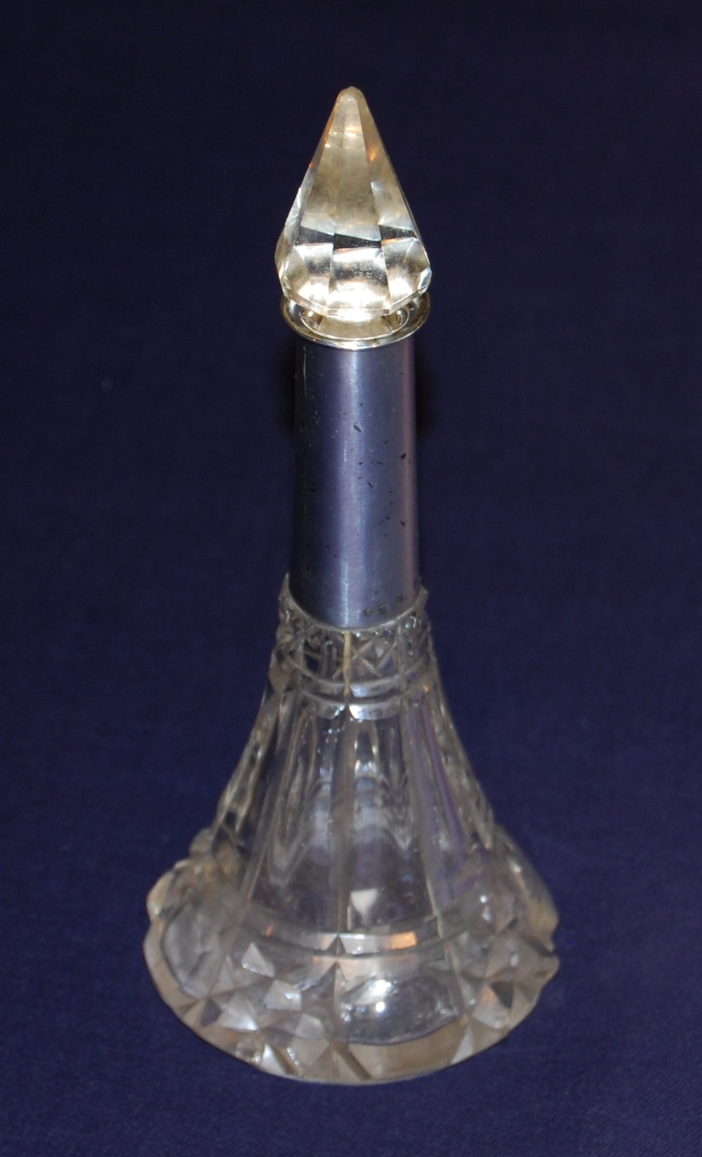 A cut glass and silver scent bottle
