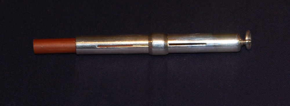 A silver cased propelling pencil retailed by Houghton & Gunn,