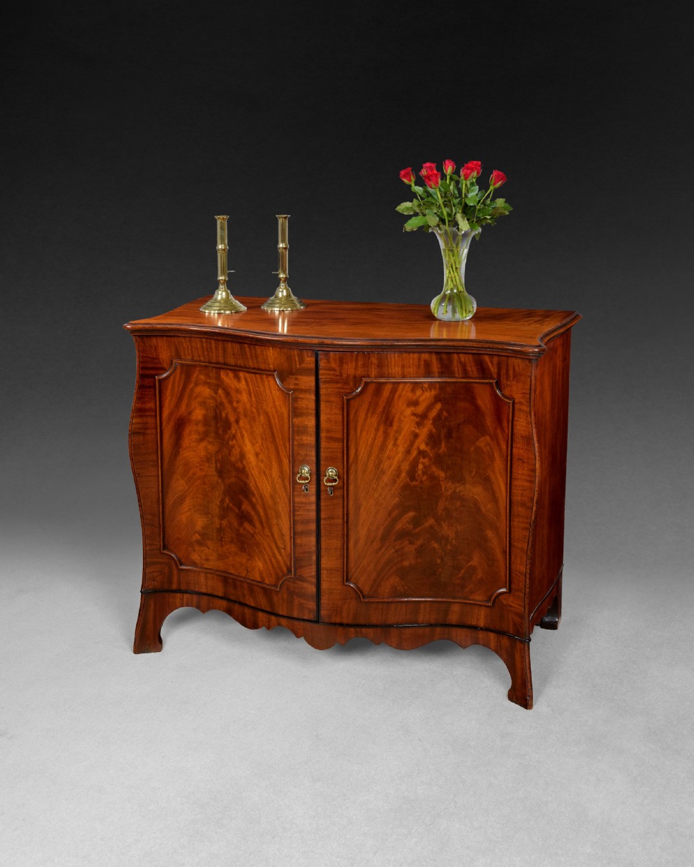 George III flame figured Mahogany Bombe Commode with ebony mouldings
