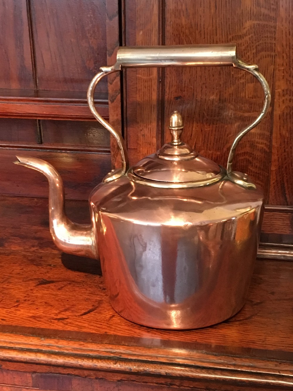 A large Victorian seamed Copper Kettle with a Brass handle and Acorn finial