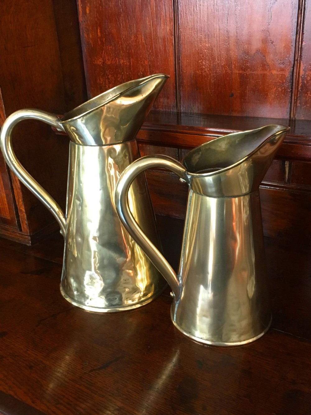 Two tall Victorian Brass Jugs