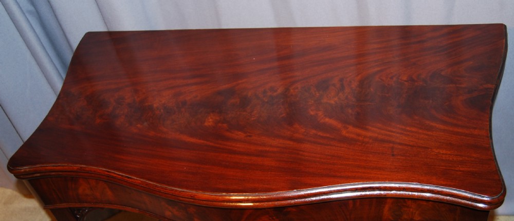 Chippendale period Serpentine shaped Mahogany Fold over top Card Table View II