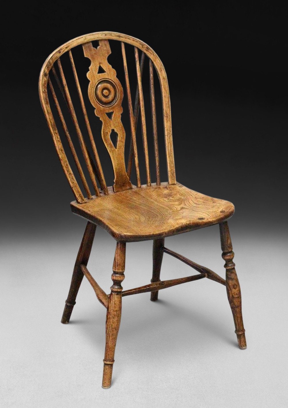 A late 18th century Elm and Oak Low Draught Back Windsor side chair 
