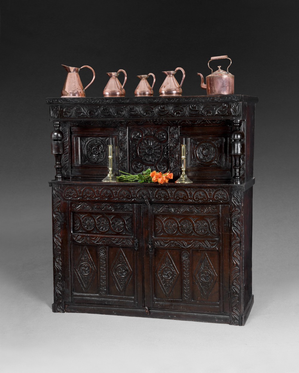 A mid 17th century carved Oak Court Cupboard