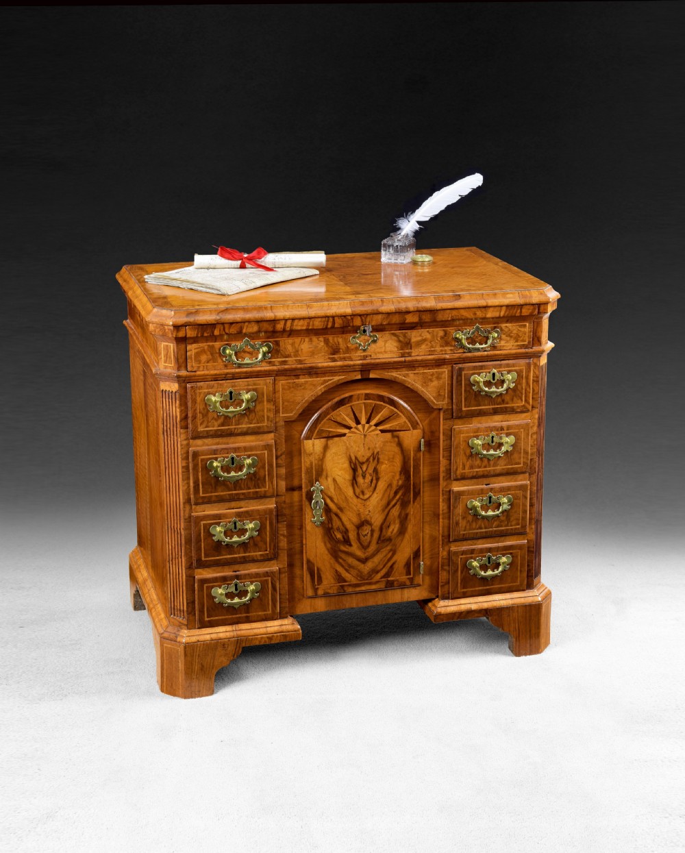 Queen Anne period walnut crossbanded and feather banded Kneehole Desk View II